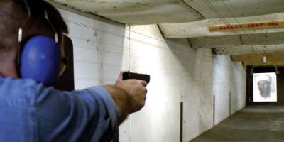 photo:
Member of the armed citizenry: A man keeps his shooting hand in using a poster of terrorist mastermind Osama bin Laden for target practice at a range in Dallas, Texas.
Ian Halperin / UPI